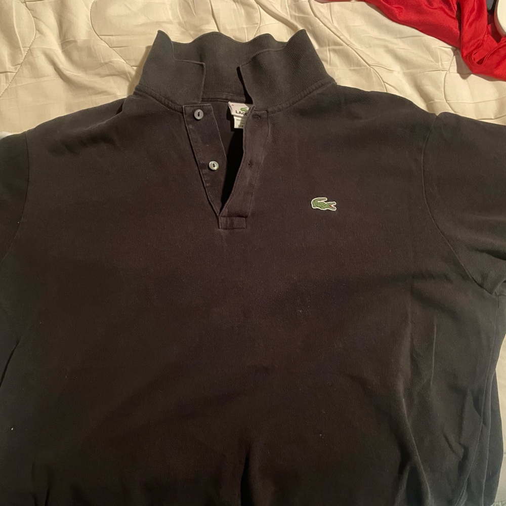 Black Lacoste polo. Gently worn. No stains or tears.